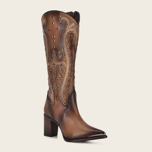 Women’s tall brown leather boot with intricate stitching and metallic studs.
