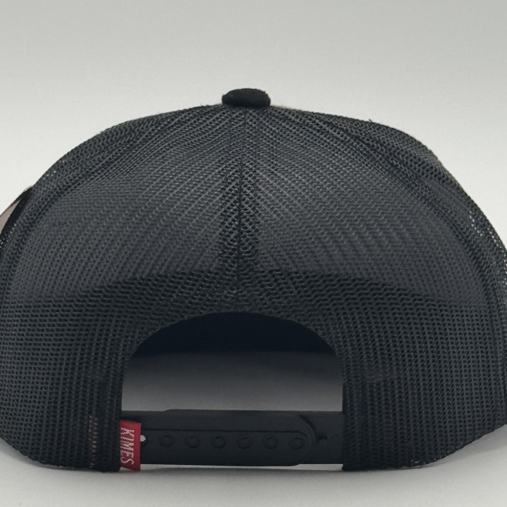 Back view showing the black mesh and adjustable snapback closure.